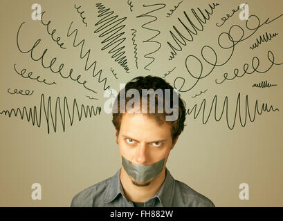 Young man with glued mouth and curly lines Stock Photo