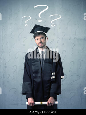 Young graduate teenager with question marks drawn Stock Photo - Alamy