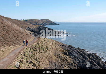 Gower Peninsula, UK. 24th February, 2016. UK Weather: : People making the most of the lovely winter sunshine on the coastal path between Langland and Caswell Bay on the Gower Peninsula this afternoon. Credit:  Phil Rees/Alamy Live News Stock Photo