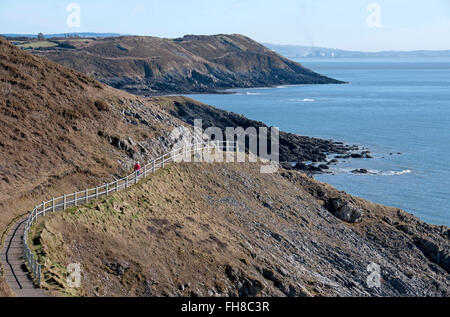 Gower Peninsula, UK. 24th February, 2016. UK Weather: : People making the most of the lovely winter sunshine on the coastal path between Langland and Caswell Bay on the Gower Peninsula this afternoon. Credit:  Phil Rees/Alamy Live News Stock Photo