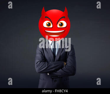 businessman wears devil smiley face Stock Photo