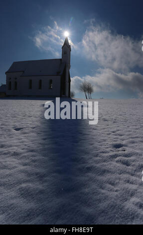 Aitrang, Germany. 24th Feb, 2016. An icicle hangs between the budding ...