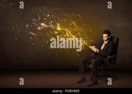 Businessman with tablet and energy explosion on background Stock Photo