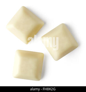 Isolated white chocolate pieces on white background; top view, with path Stock Photo