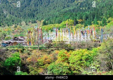 Stupas and flags at Shuzheng Tibetan village, Jiuzhaigou National Park, Sichuan Province, China, Unesco World Heritage Site Stock Photo