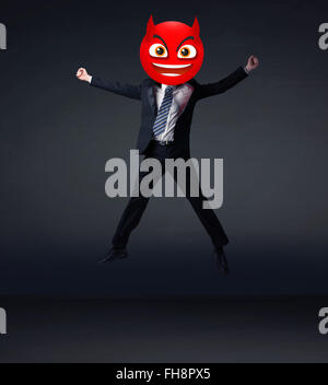 businessman wears devil smiley face Stock Photo