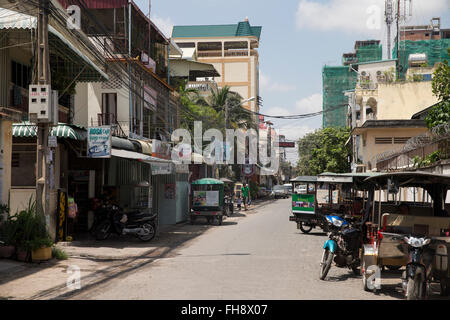 Street with motorbike and buildings in Phnom Penh, Cambodia Stock Photo