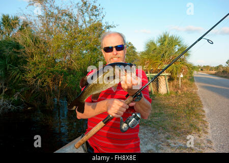 bank fishing. fisherman with spinning rod at sunset. copy space Stock Photo  - Alamy