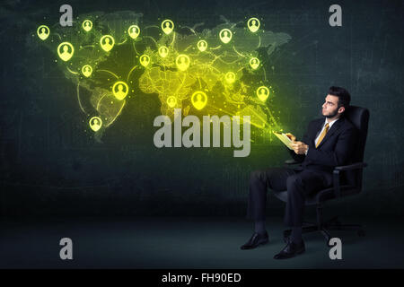 Businessman in office with tablet and social network world map Stock Photo