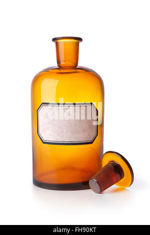 Old brown medicine bottle with an empty label on white background Stock Photo