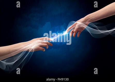 Hands connecting through fingers in space Stock Photo