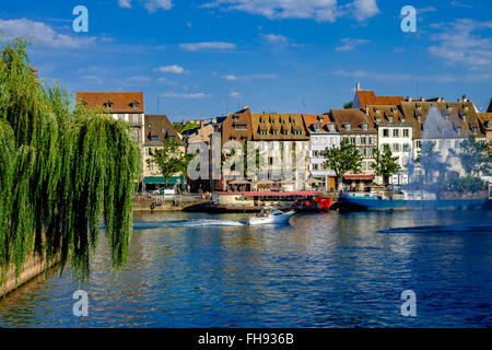 'Quai des Pêcheurs' fishermen quay with barges on Ill river and waterfront houses, Strasbourg, Alsace, France, Europe Stock Photo