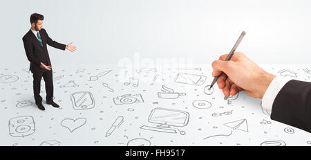 Little businessman looking at hand drawn icons and symbols Stock Photo
