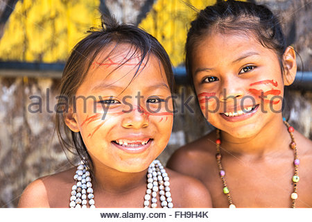 Native Brazilian girls smiling at an indigenous tribe in the Amazon ...