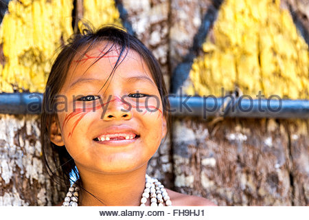 Native Brazilian girl smiling at an indigenous tribe in the Amazon ...