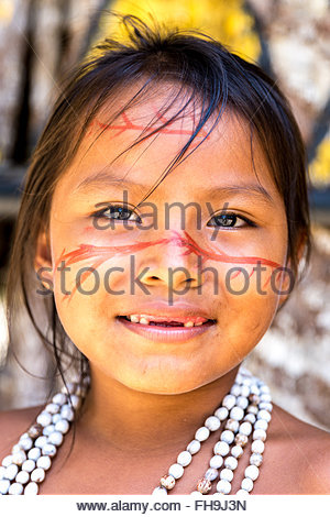 Native Brazilian girl smiling at an indigenous tribe in the Amazon ...