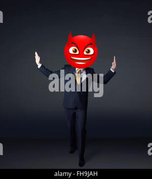 businessman wears devil smiley face Stock Photo