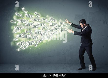 Business person throwing a lot of dollar bills concept Stock Photo