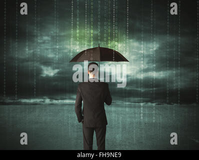 Business man standing with umbrella data protection concept Stock Photo