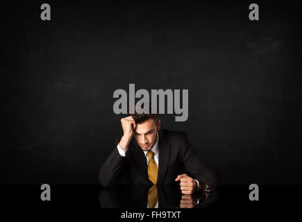 Businessman sitting at a desk Stock Photo