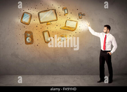 Man throwing hand drawn electronical devices Stock Photo