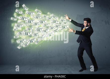 Business person throwing a lot of dollar bills concept Stock Photo