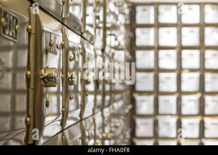 Many po boxes at the post office. The mail boxes are lined up in rows and columns. Selective focus Stock Photo