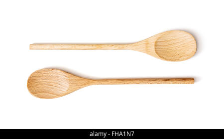 Two wooden spoons on the white background. Kitchen equipment. Stock Photo