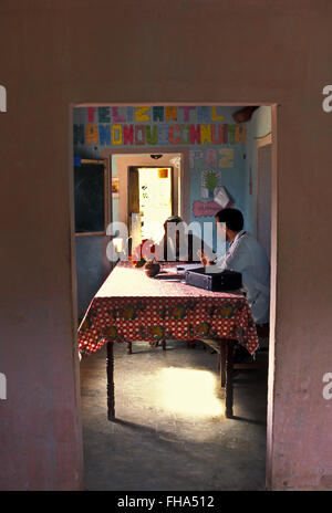 Family Doctor Program ( Programa Medico de Familia ) supported by the Brazilian Government - poor families from countryside Brazil receive healthcare and family medicine at local rural school, based on knowledge of the patient in the context of the family and the community, emphasizing disease prevention and health promotion. Rural area of Palmares city, Pernambuco State, Brazil. Stock Photo