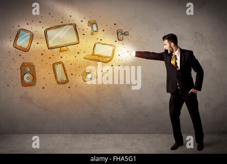 Man throwing hand drawn electronical devices Stock Photo