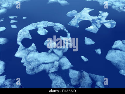 Puzzle head idea and concept as a human face profile made from floating icefloating away in water with a jigsaw piece cut out on a cold blue arctic background as a mental health symbol. Stock Photo