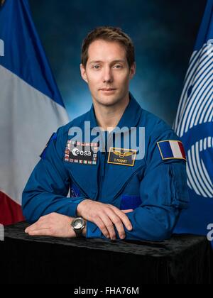 European Space Agency astronaut and Expedition 50/51 crew member Thomas Pesquet official portrait wearing the blue flight suit at the Johnson Space Center January 14, 2016 in Houston, Texas. Stock Photo