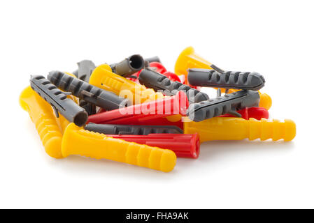 Closeup of colorful plastic dowels isolated on white background. Stock Photo