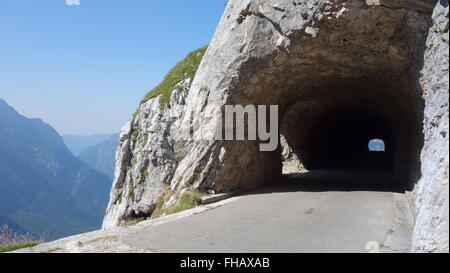 View through a tunnel high up on the Mangart mountain road in Slovenia Stock Photo