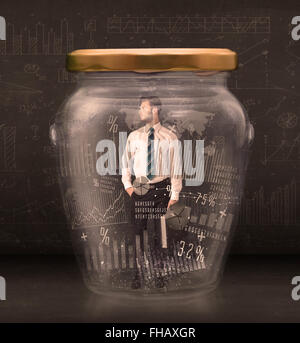 Businessman traped in jar with graph chart symbols concept Stock Photo
