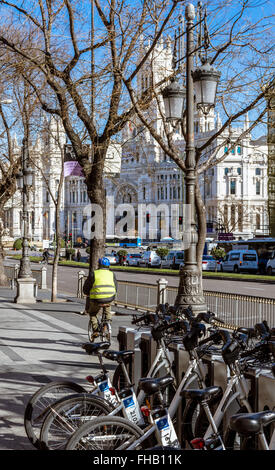The City Hall of Madrid or the former Palace of Communications and a Bicimad parking, public bike rental system of Madrid, Spain Stock Photo