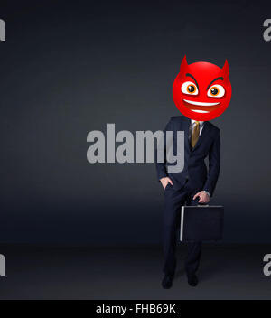 businessman wears devil smiley face Stock Photo