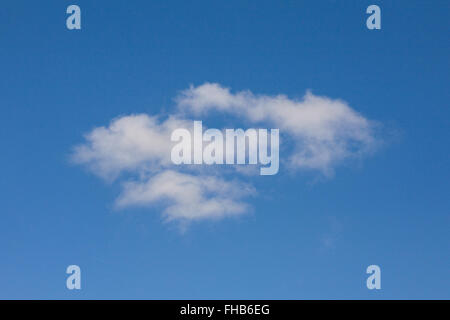 White clouds in a blue sky on a Winter's day. Stock Photo