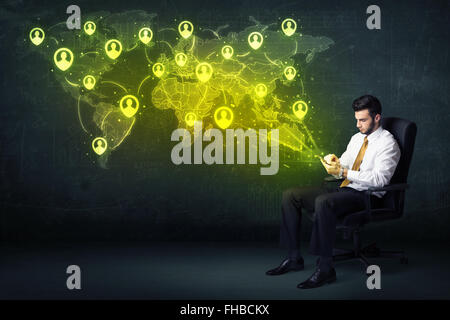 Businessman in office with tablet and social network world map Stock Photo