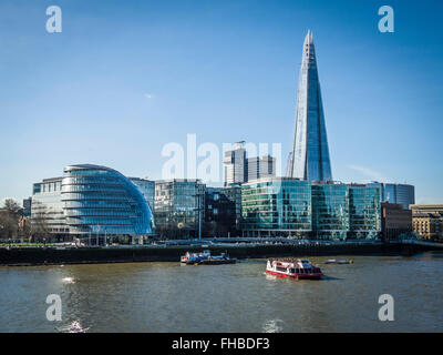 City Hall, The Shard and More London on the South bank of The River Thames from Tower Bridge, City of London, England, UK Stock Photo