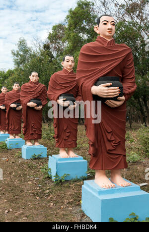 Row of statues of 500 Arahant followers of Buddha at Win Sein, Mudon near Mawlamyine, Mon State, Burma - Myanmar Stock Photo