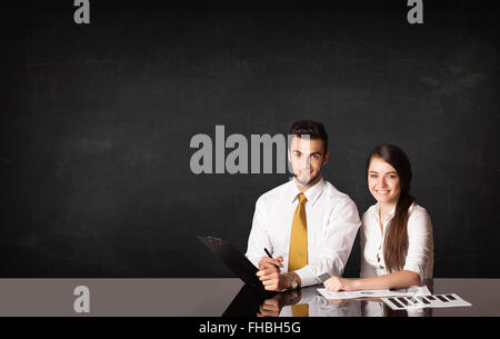 Business couple with black background Stock Photo