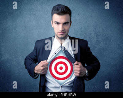 Businessman tearing shirt with target sign on his chest Stock Photo