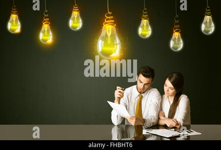 Business couple with idea bulbs Stock Photo