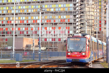 A tram passes by a refurbished block of apartments on the Park hill housing estate in the centre of the City of Sheffield, UK Stock Photo