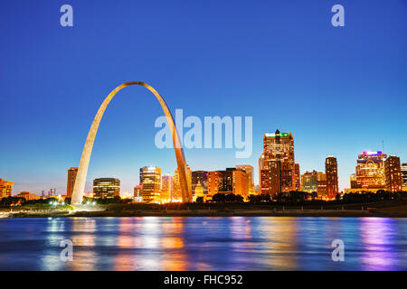 Downtown St Louis, MO with the Old Courthouse and the Gateway Arch at sunset Stock Photo