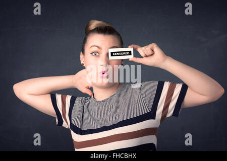 Pretty girl with censored paper sign Stock Photo