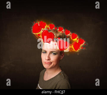 teenager girl with heart illustrations circleing around her head Stock Photo