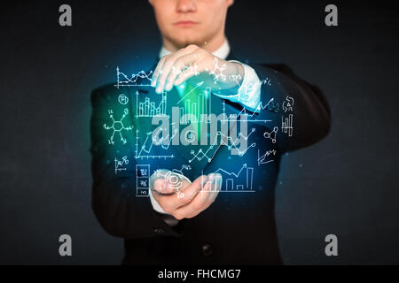 holding hand drawn business diagrams Stock Photo