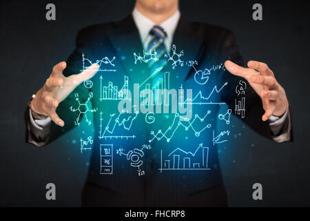 holding hand drawn business diagrams Stock Photo